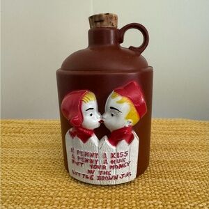 Vintage Little Brown Jug Bank with Kissing Dutch Girl and Boy